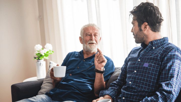 A Senior Man Having A Conversation With His Son