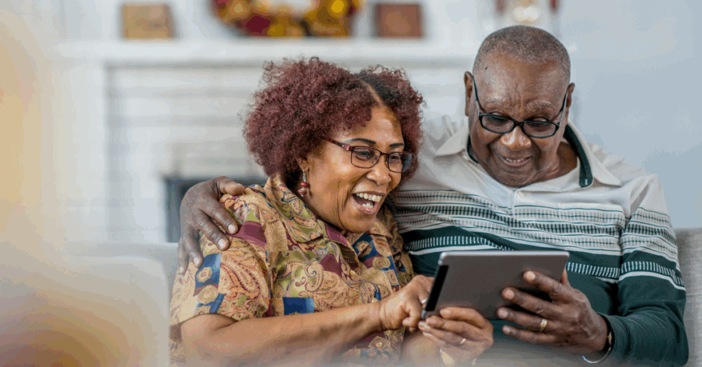 Digital Storytelling For Seniors In Memory Care 3 An Elderly Couple Looking At Their Photo Album